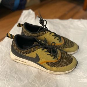Nike sneakers in gold color